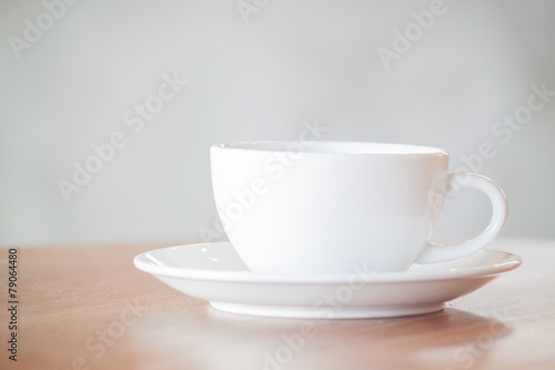 White coffee cup on wooden table