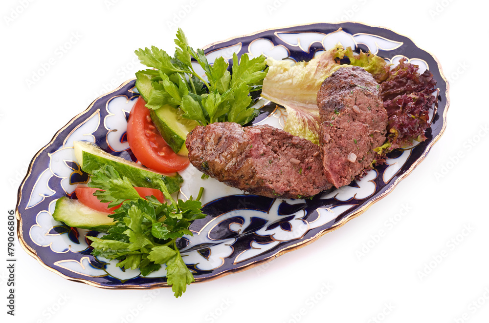 Meat on a grill with vegetables Meat on a grill with vegetables