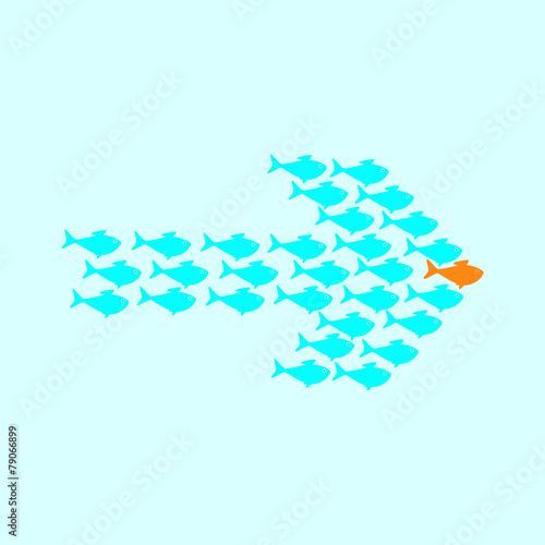School of fish swimming in shape of arrow