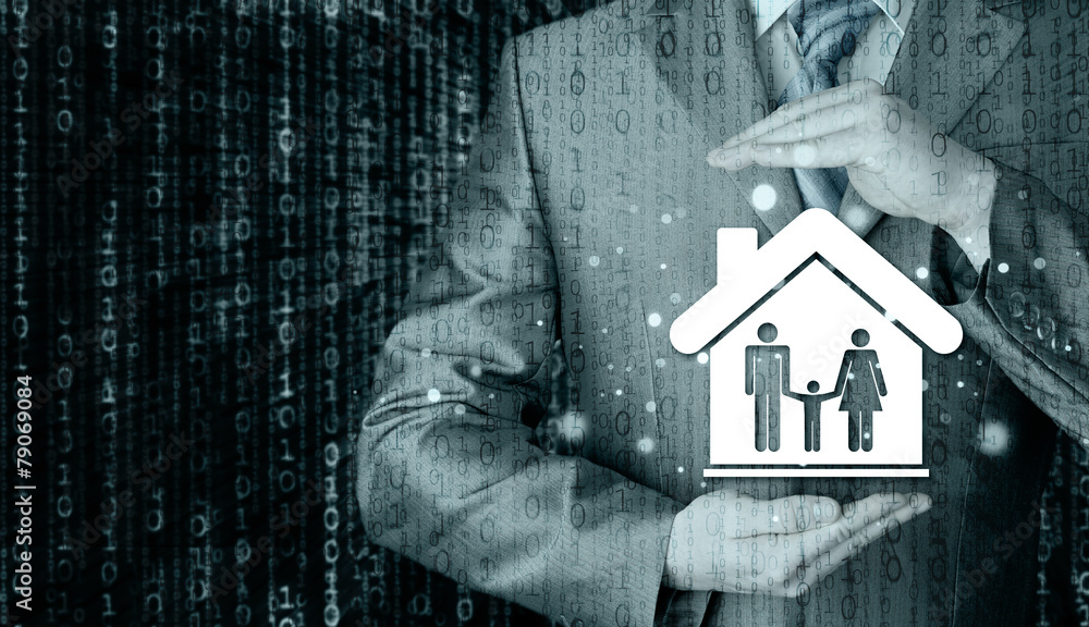 businessman protecting family in home with hands businessman protecting family in home with hands