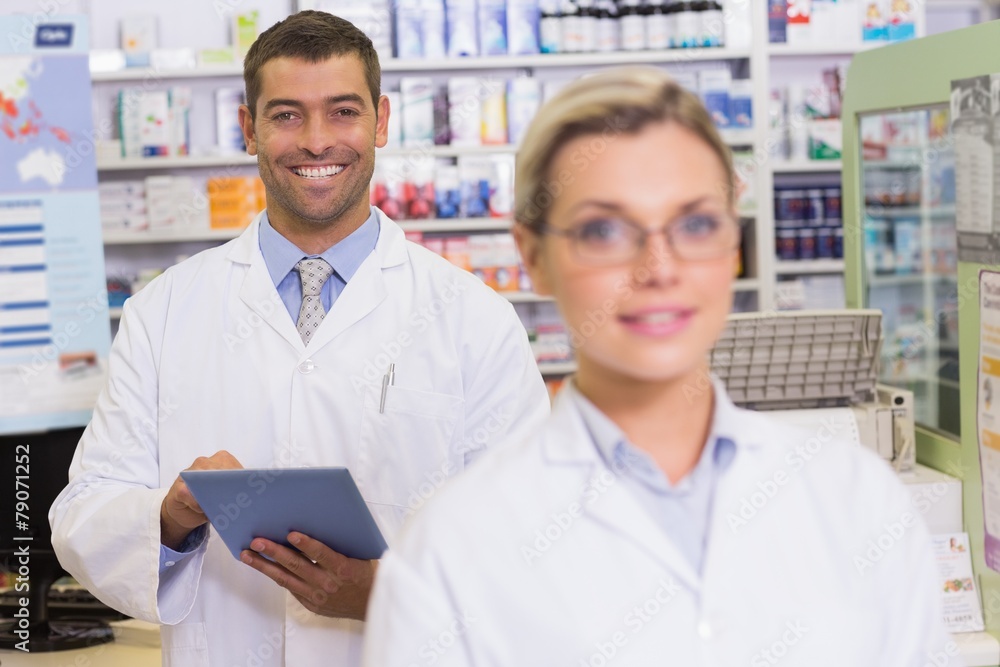 pharmacists looking at camera pharmacists looking at camera