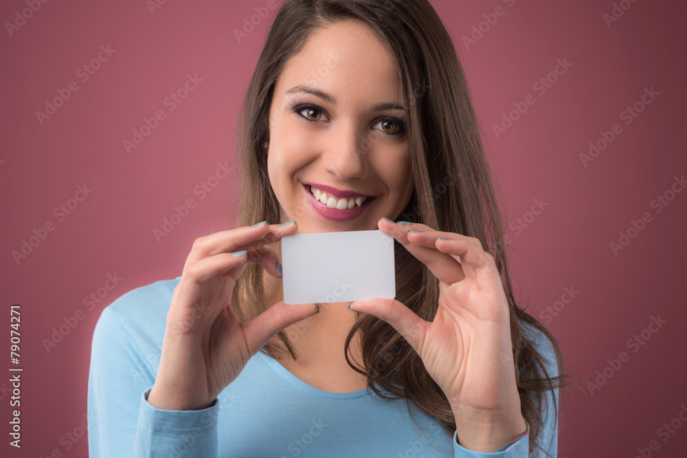 Smiling girl with business card Smiling girl with business card