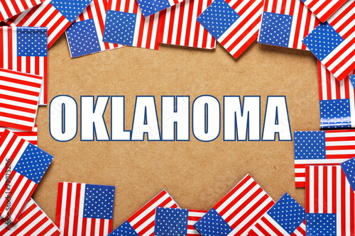 The title Oklahoma with a border of USA flags