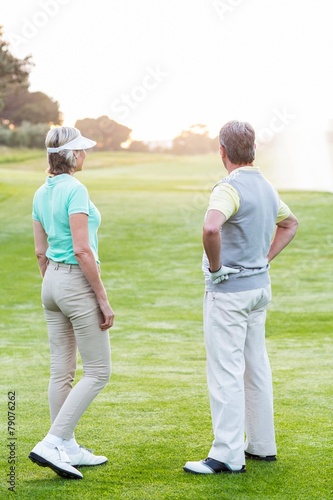 Golfing couple on the putting green