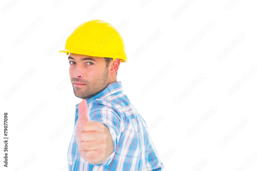 Portrait of confident handyman gesturing thumbs up