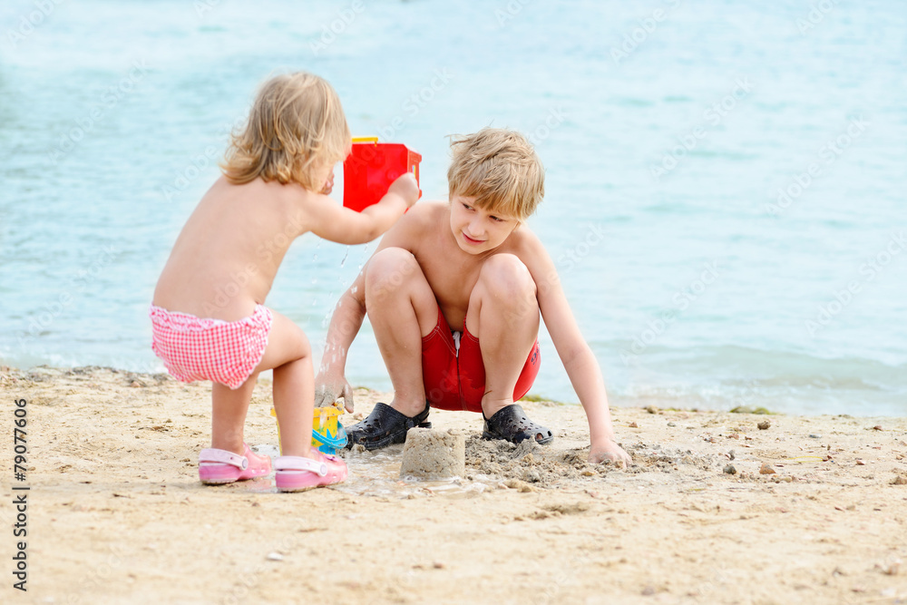 brother and sister on the beach