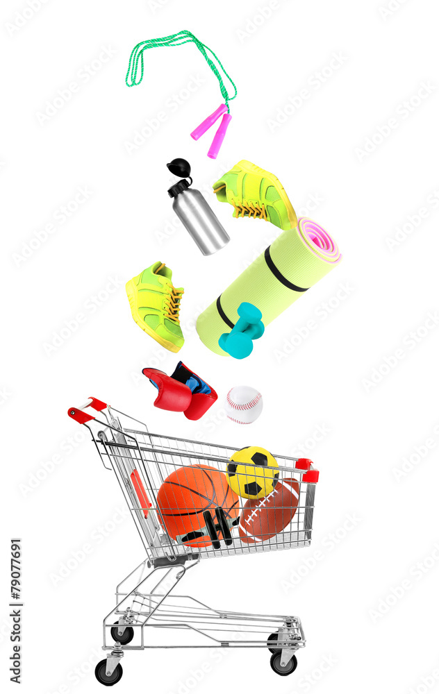 Sport goods falling into cart isolated on white