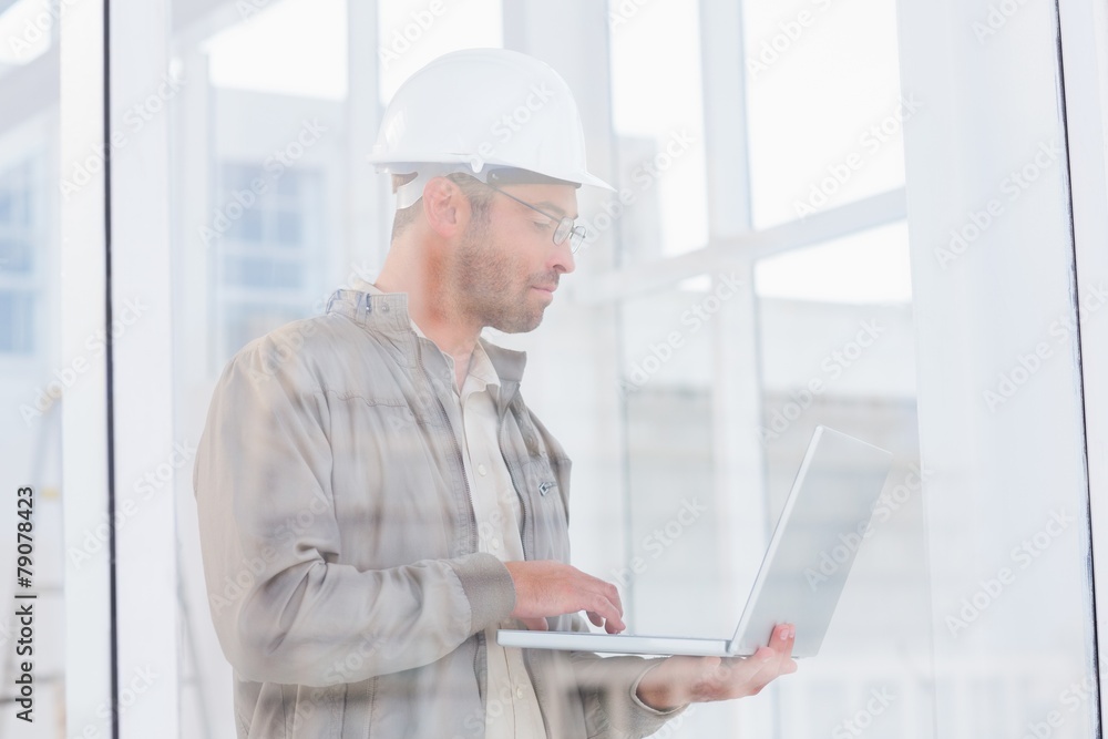 architect using laptop in office architect using laptop in office