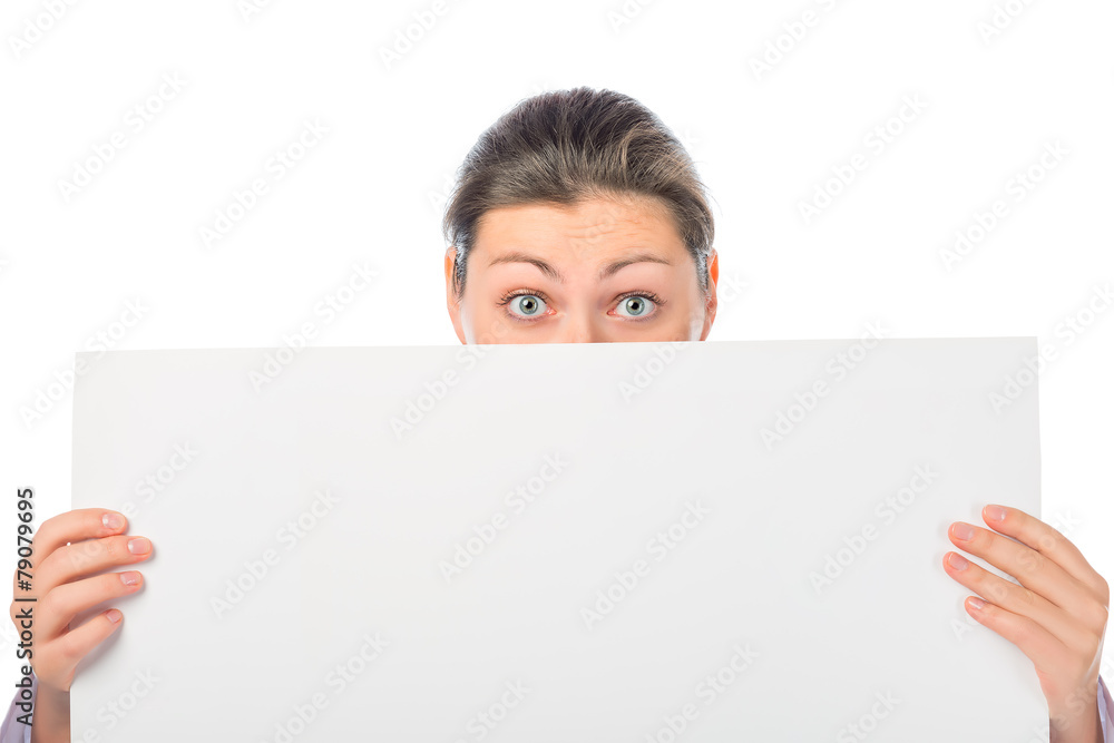 portrait of a girl with eyes wide open with a large white poster portrait of a girl with eyes wide open with a large white poster