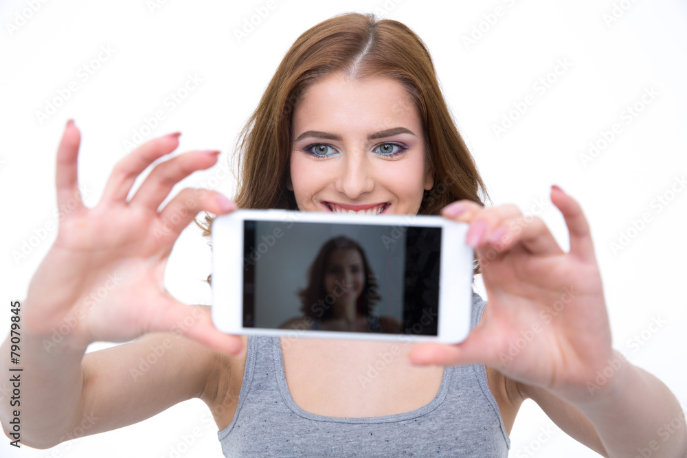 Happy woman taking selfie photo on smartphone
