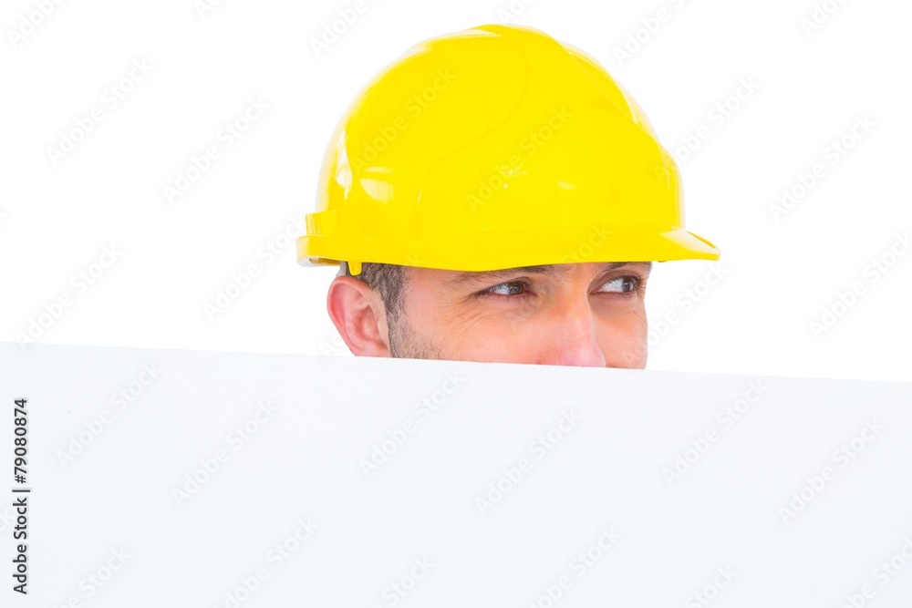 Handyman hidden behind blank board Handyman hidden behind blank board