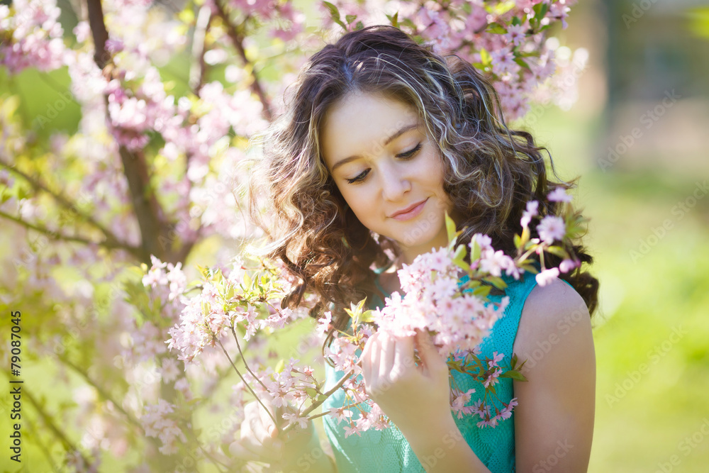 Beautiful young girl in flowers