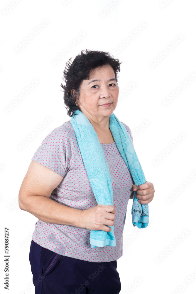 Old Asian woman smiling after workout, holding towel around neck Old Asian woman smiling after workout, holding towel around neck