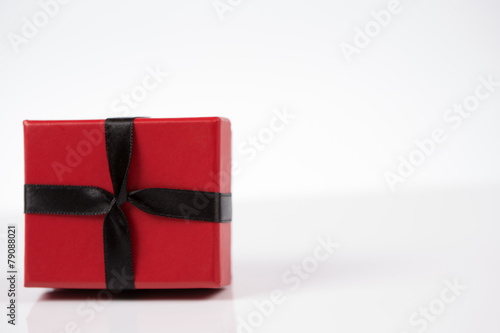 Red and pink gift box on white background isolated