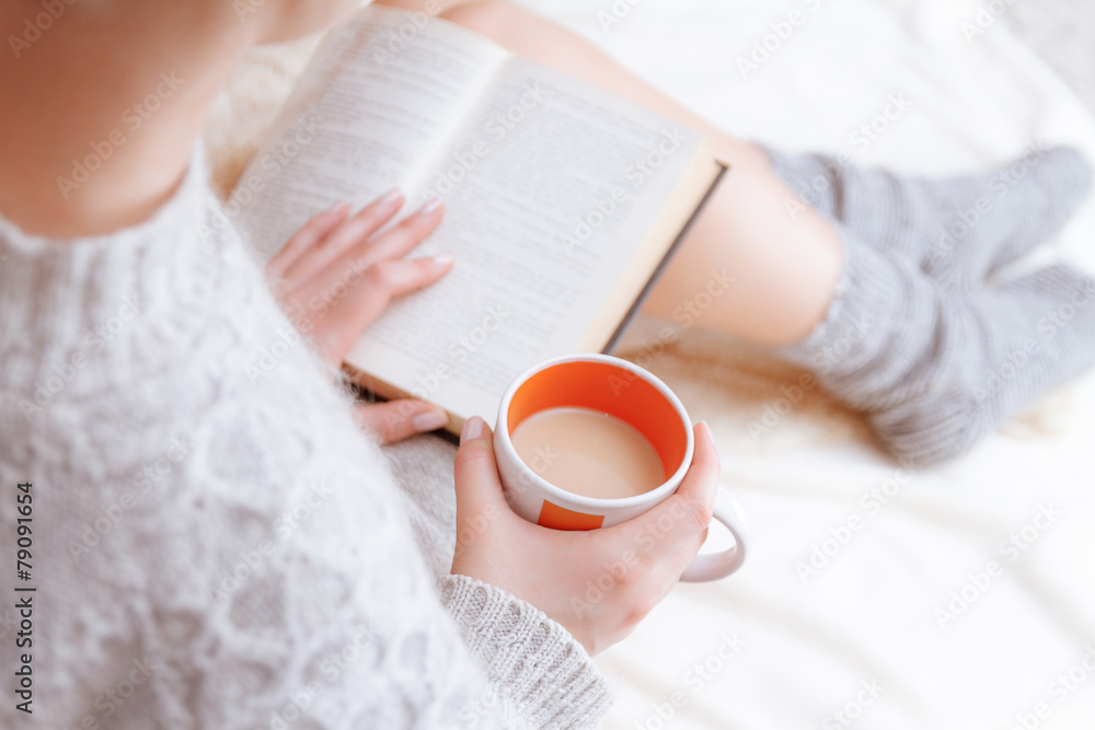 Soft photo of woman on the bed with old book in hands Soft photo of woman on the bed with old book in hands