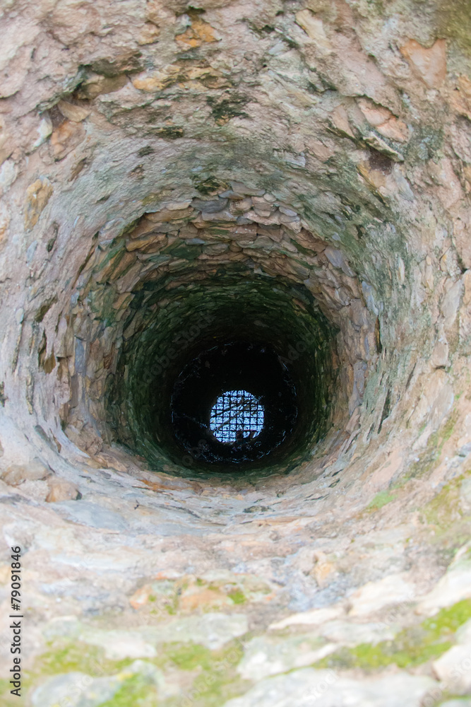 Very deep old water well with grid. Very deep old water well with grid.