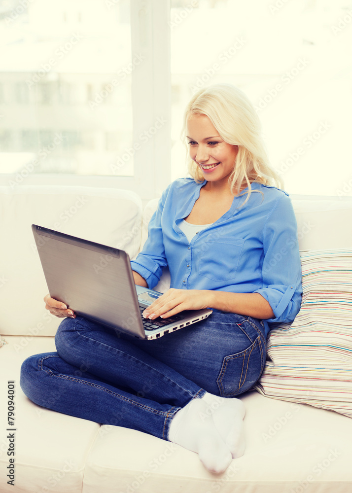 smiling woman with laptop computer at home smiling woman with laptop computer at home