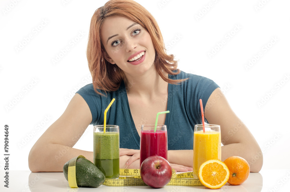Happy woman having a table full of organic food,juices,smoothie Happy woman having a table full of organic food,juices,smoothie