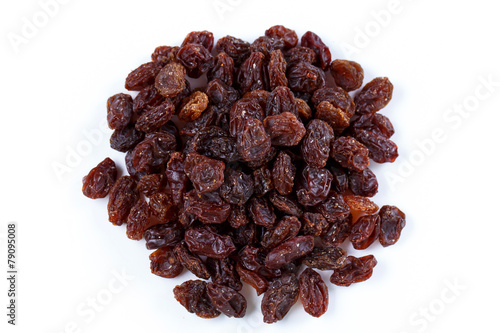 Heap of sultana raisins on white background
