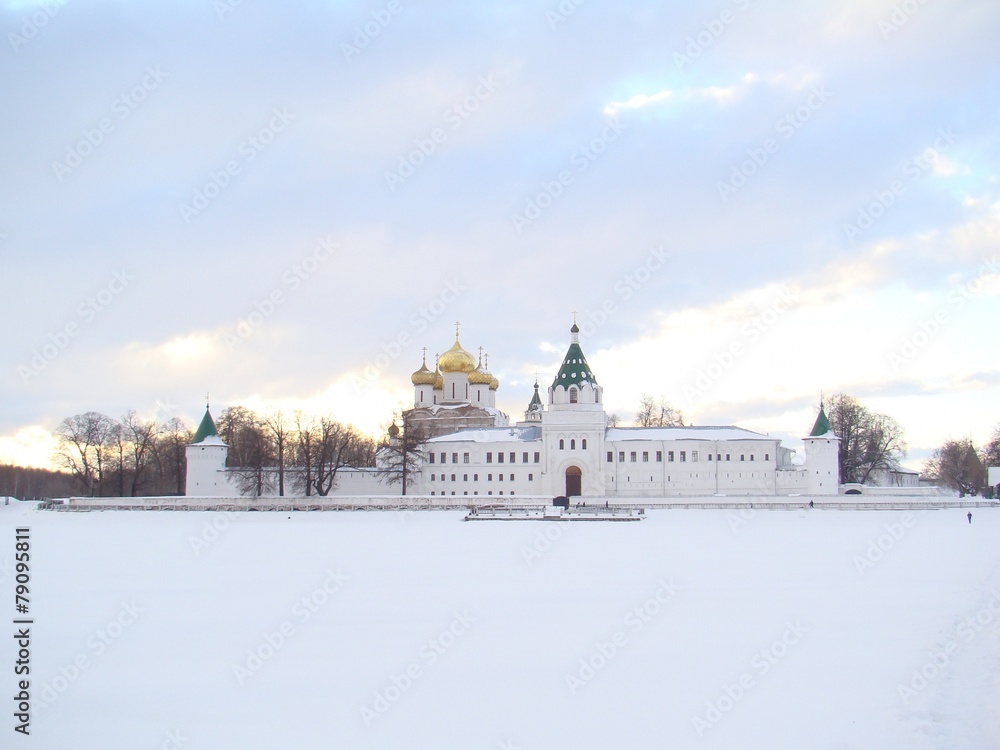Russian monastery-fortress on the river in winter