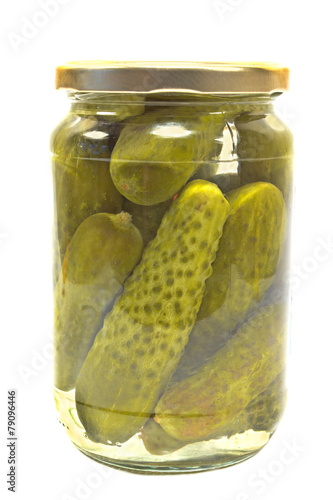 Pickled cucumbers in jar isolated on white