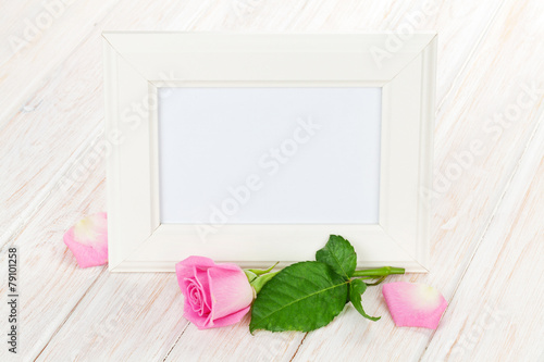 Blank photo frame and pink rose