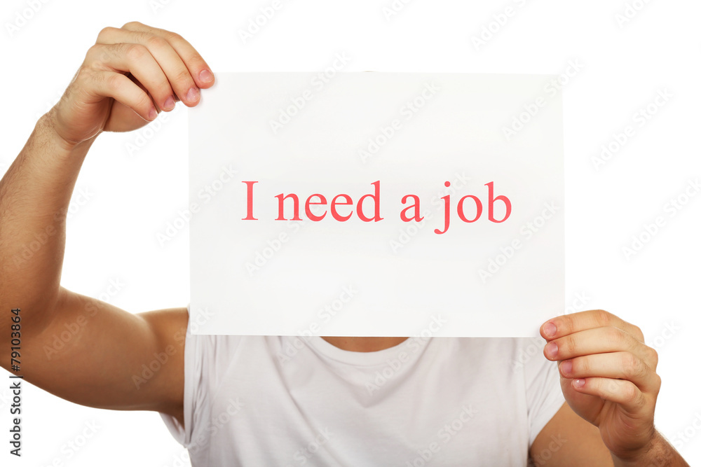 Sheet of paper with inscription I need a job in male hand Sheet of paper with inscription I need a job in male hand