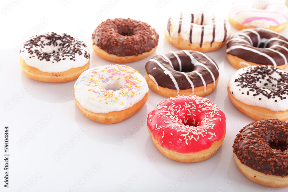 Delicious donuts with icing isolated on white Delicious donuts with icing isolated on white