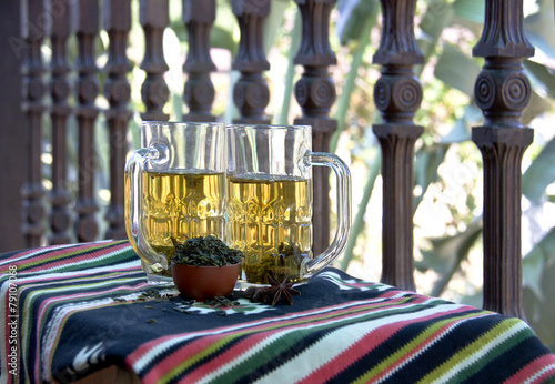 healthy green tea cups with tea leaves photo