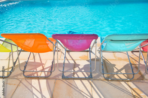 Colorful chairs at swimming pool