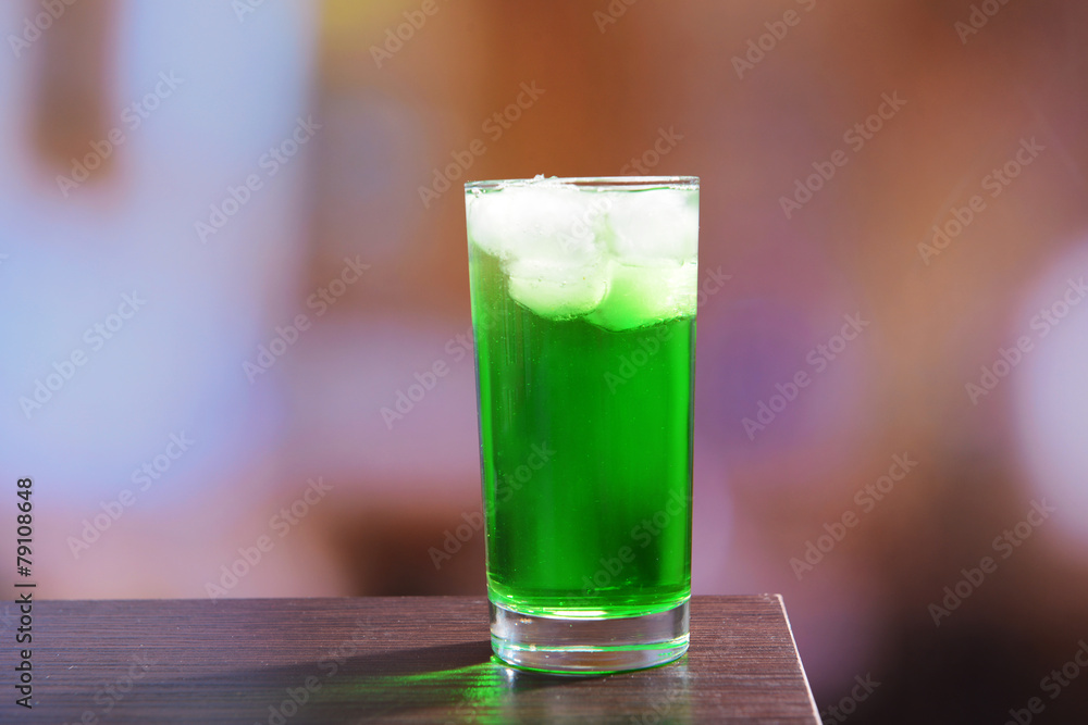 Green cocktail on table on light background Green cocktail on table on light background