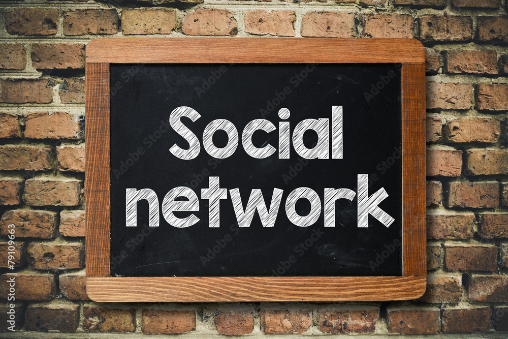 Fototapeta premium Social network on Blackboard on bricks wall