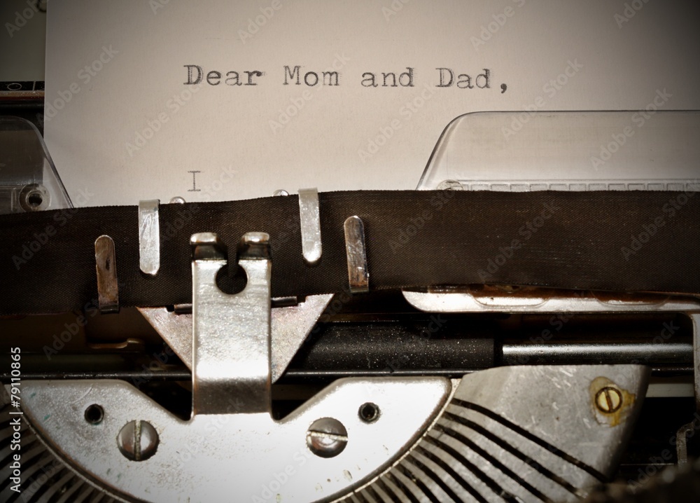 Text Dear Mom and Dad typed on old typewriter