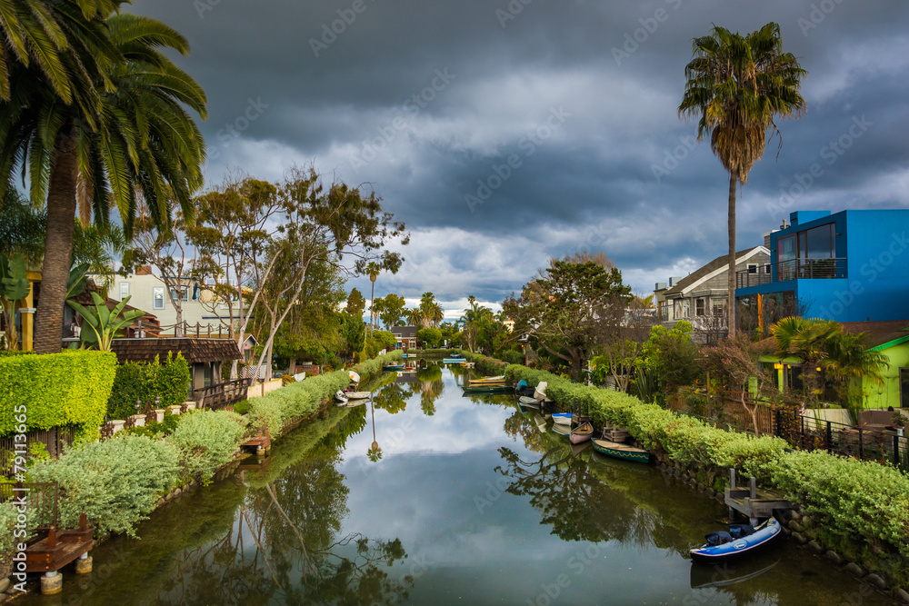 Houses and boats along a canal in Venice Beach, Los Angeles, Cal