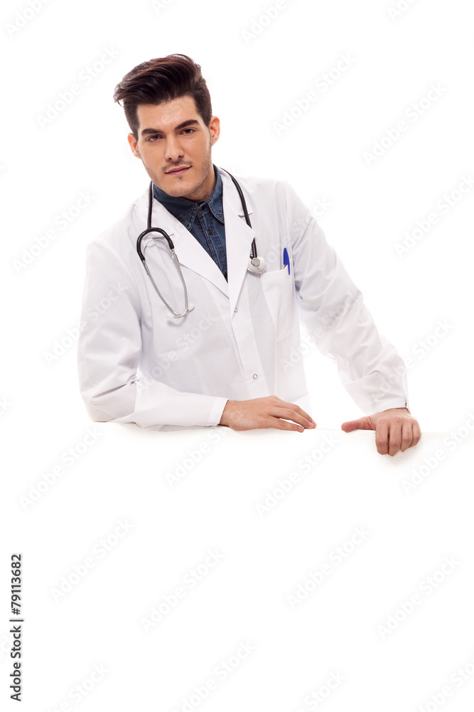 Male doctor with jeans shirt over white isolated background Male doctor with jeans shirt over white isolated background