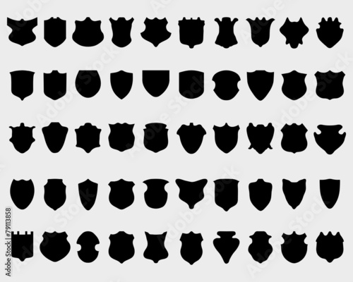 Black silhouettes of shields on white a background, vector