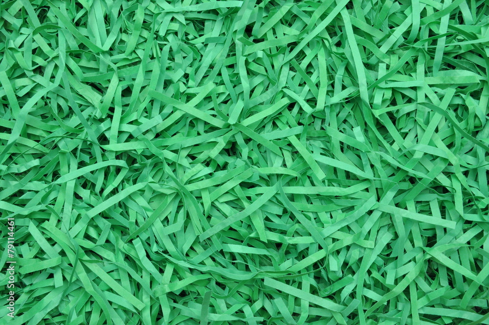 Naklejka premium Shredded paper as background, packaging material