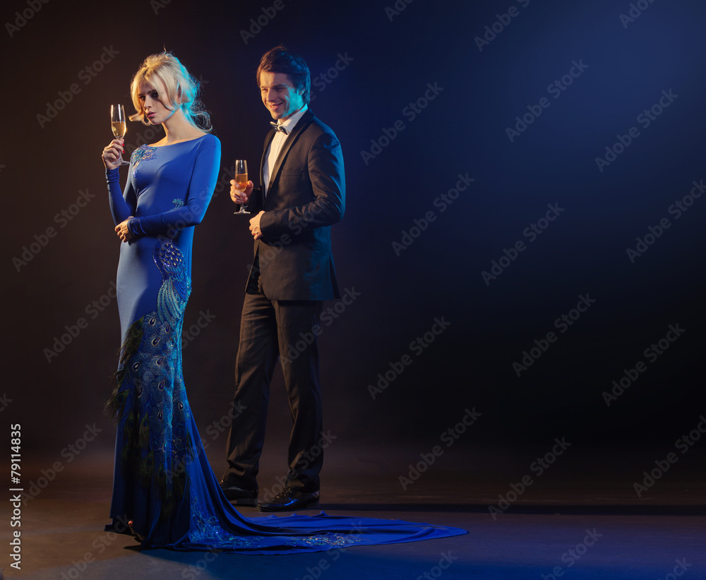 Fototapeta premium Handsome man and the woman wearing the evening gown