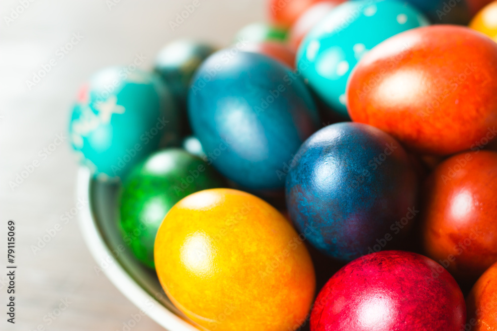 Easter eggs on plate. Colorful handmade painted holiday attribute Easter eggs on plate. Colorful handmade painted holiday attribute