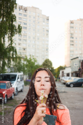 Girl with dandelion. Female portrait