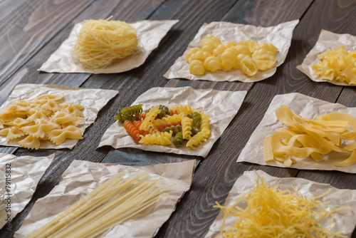 Various pasta on the wooden table