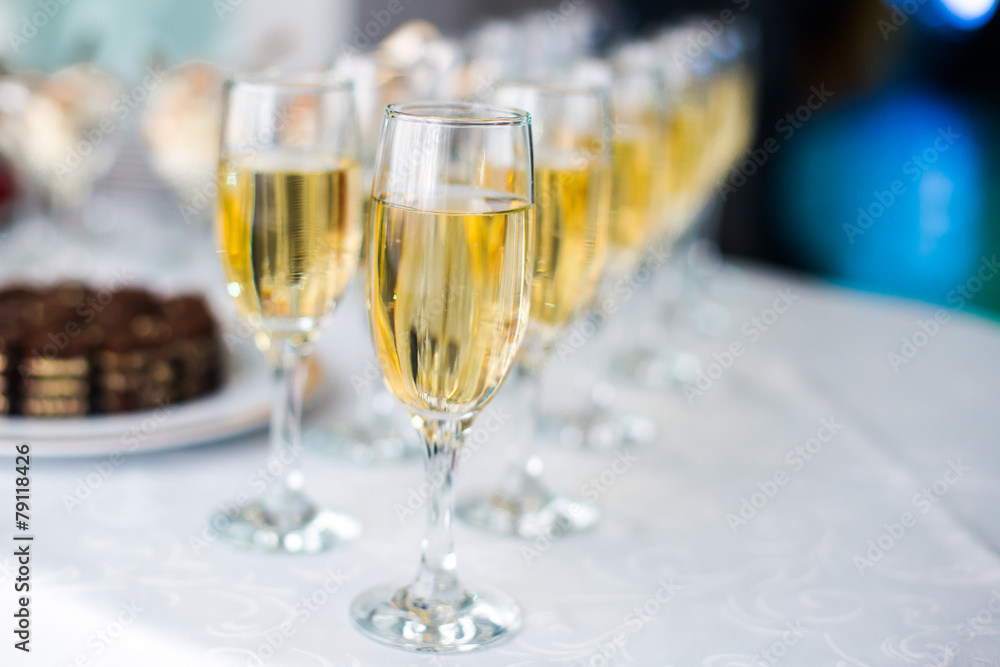 Beautiful line of different colored alcohol cocktails on party