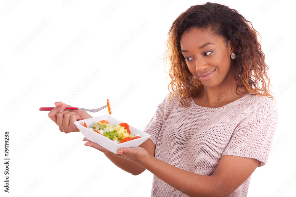 African American woman eating salad, isolated on white backgroun