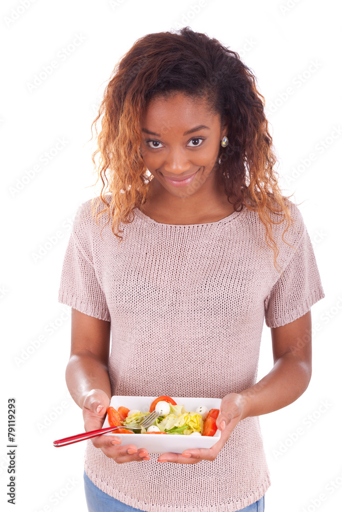 African American woman eating salad, isolated on white backgroun African American woman eating salad, isolated on white backgroun