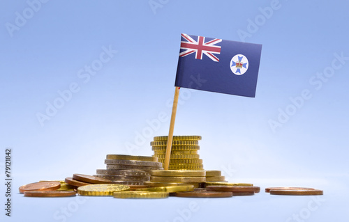 Flag of Queensland in a stack of coins.(series)