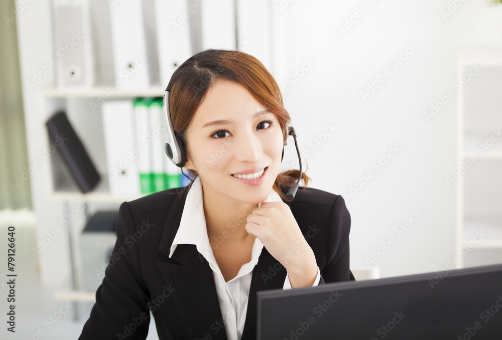 young beautiful businesswoman with headset in office young beautiful businesswoman with headset in office