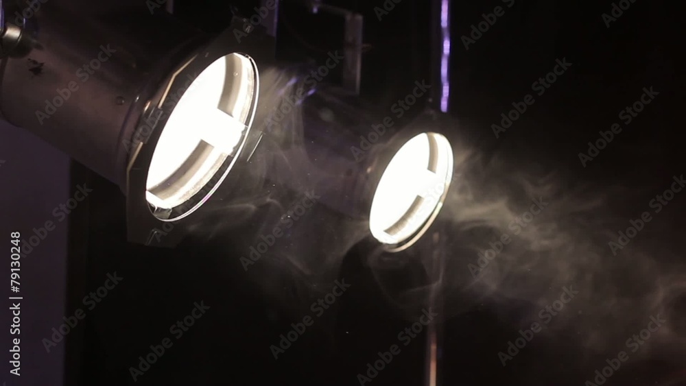 two spot lights with smoke particles in slow motion two spot lights with smoke particles in slow motion