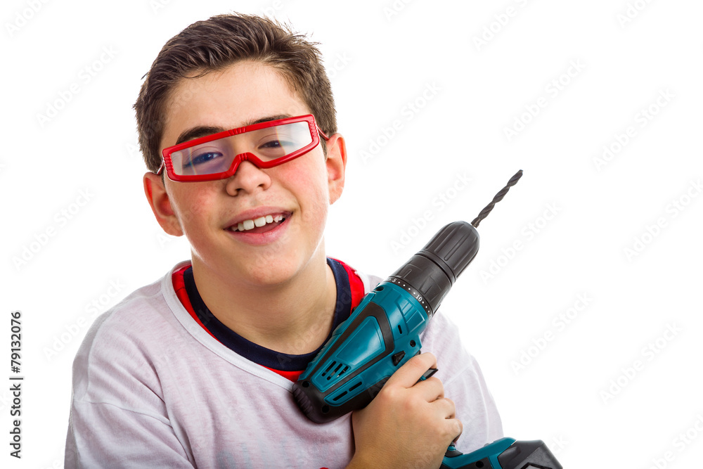 Child wearing red goggles and holding a cordless drill Child wearing red goggles and holding a cordless drill