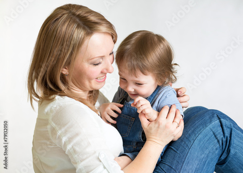 Mother playing with child. ...