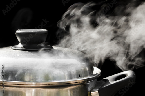 steam over cooking pot